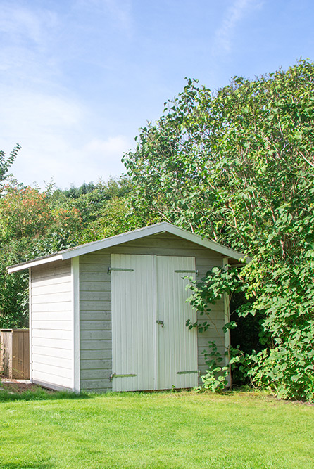Grey and white wooden shed